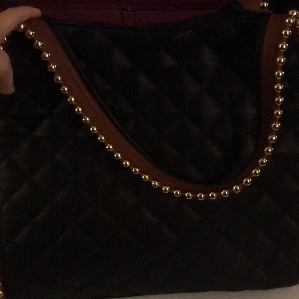 Oversized black faux leather handbag